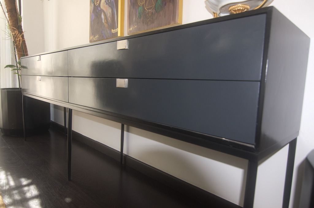 Minimalist sideboard in dining with fine finished black color in luxury duplex renovation