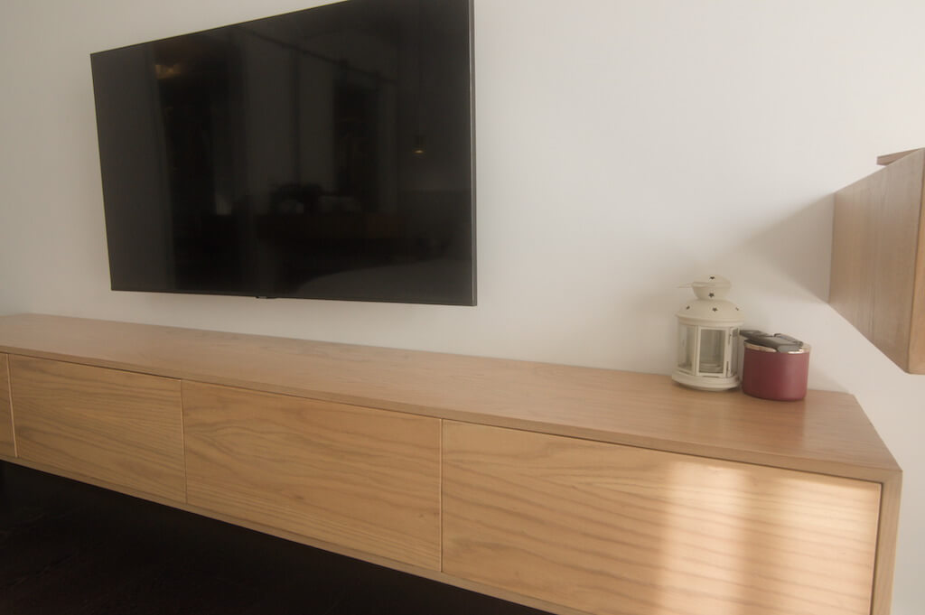 Master bedroom with soft neutral tones, minimalist furniture, and layered textures in Sodic Westown duplex renovation
