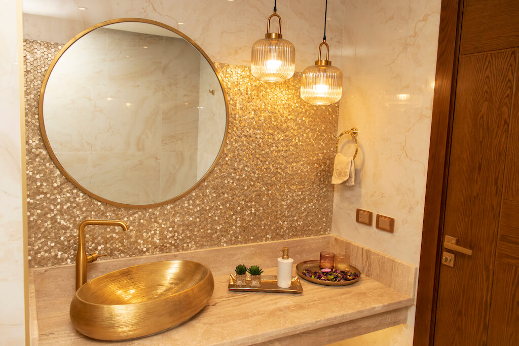 Luxury Guests bathroom design with gold tiles in turnkey Heliopolis flat