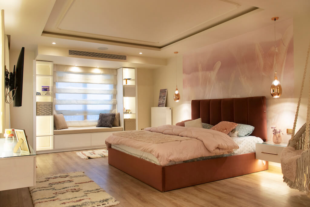 Master bedroom featuring layered lighting, soft wall finishes, and smart climate control in a turnkey interior