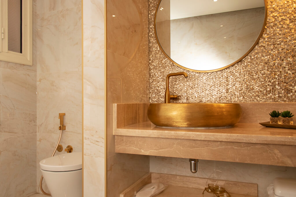 Luxury Guests bathroom design with gold tiles in turnkey Heliopolis flat