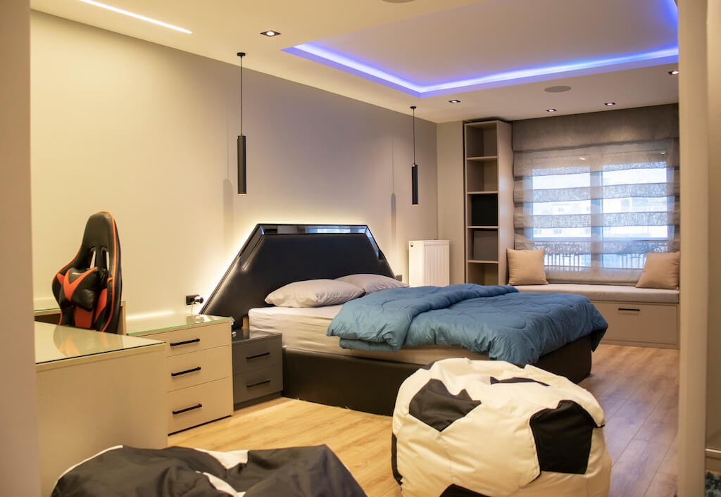 Modern bedroom with black and grey palette, smart lighting, and integrated wardrobe in Heliopolis interior project