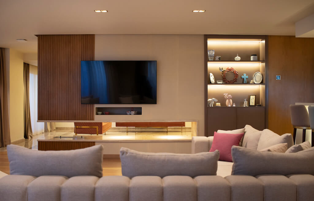 Modern living room with flat ceiling, recessed lighting, and custom furniture in a turnkey Heliopolis flat