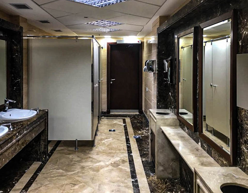 Renovated commercial bathroom with modern fixtures in a five-story office building in Maadi