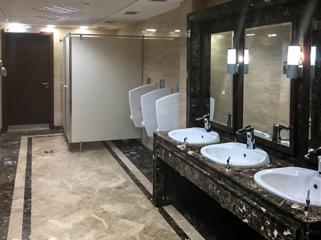 Renovated commercial bathroom with modern fixtures in a five-story office building in Maadi