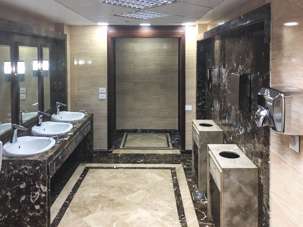 Renovated commercial bathroom with modern fixtures in a five-story office building in Maadi