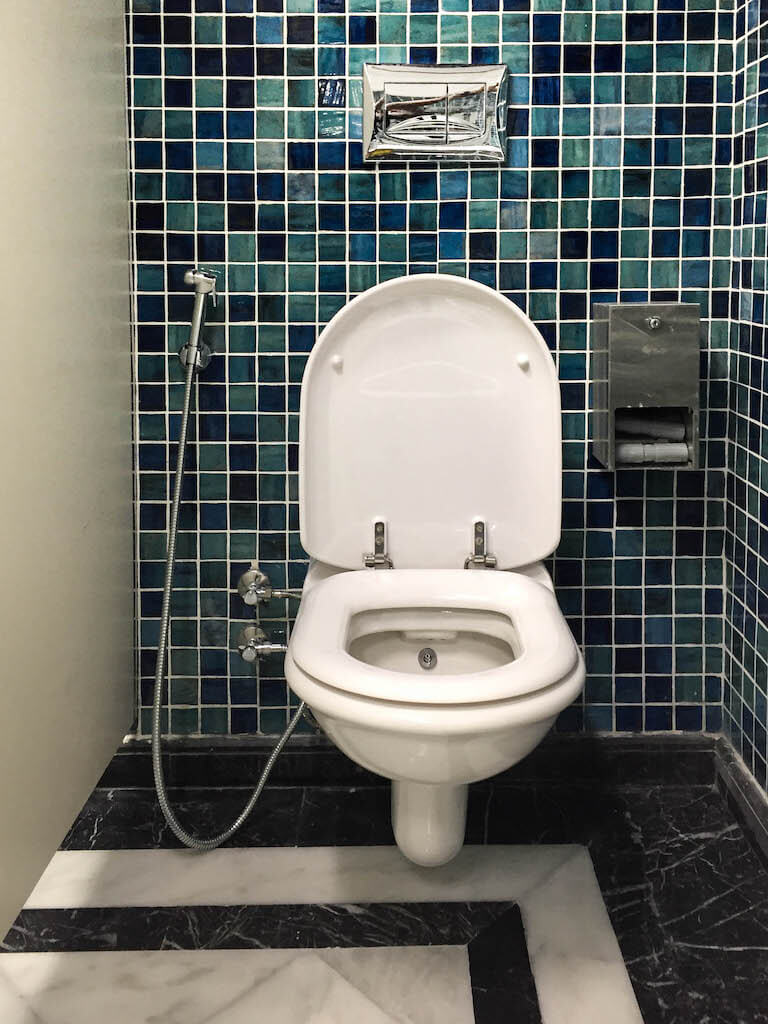 Upgraded gym bathroom with clean finishes and durable materials in office building renovation project