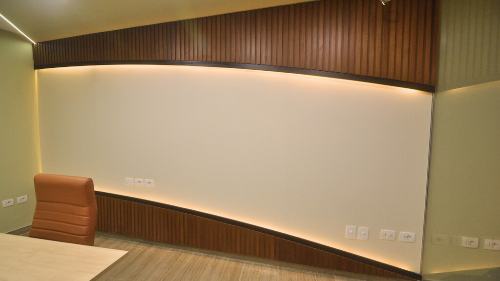 Soft-tone wall finishes and integrated lighting in corporate basement renovation project