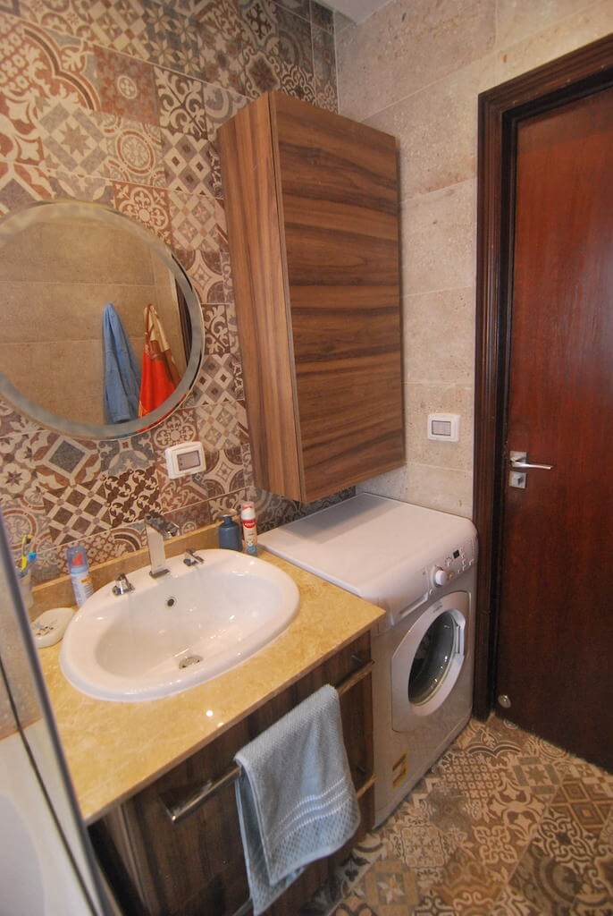 Rustic-inspired bathroom with earthy tones and modern layout in N Teseen apartment