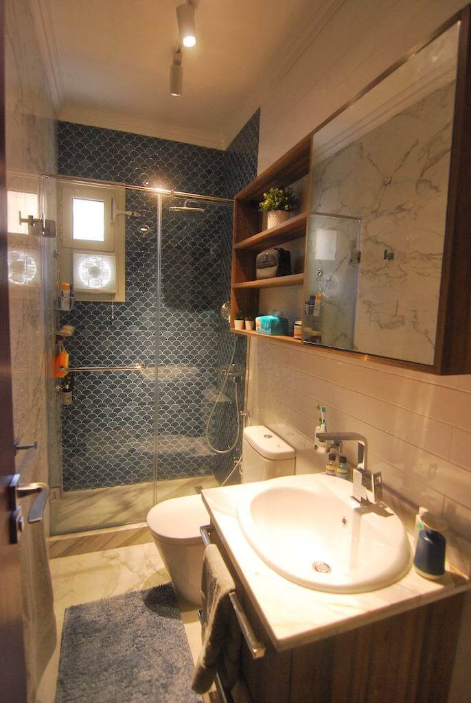 vibrant bathroom with sleek fixtures and warm textures in residential flat renovation