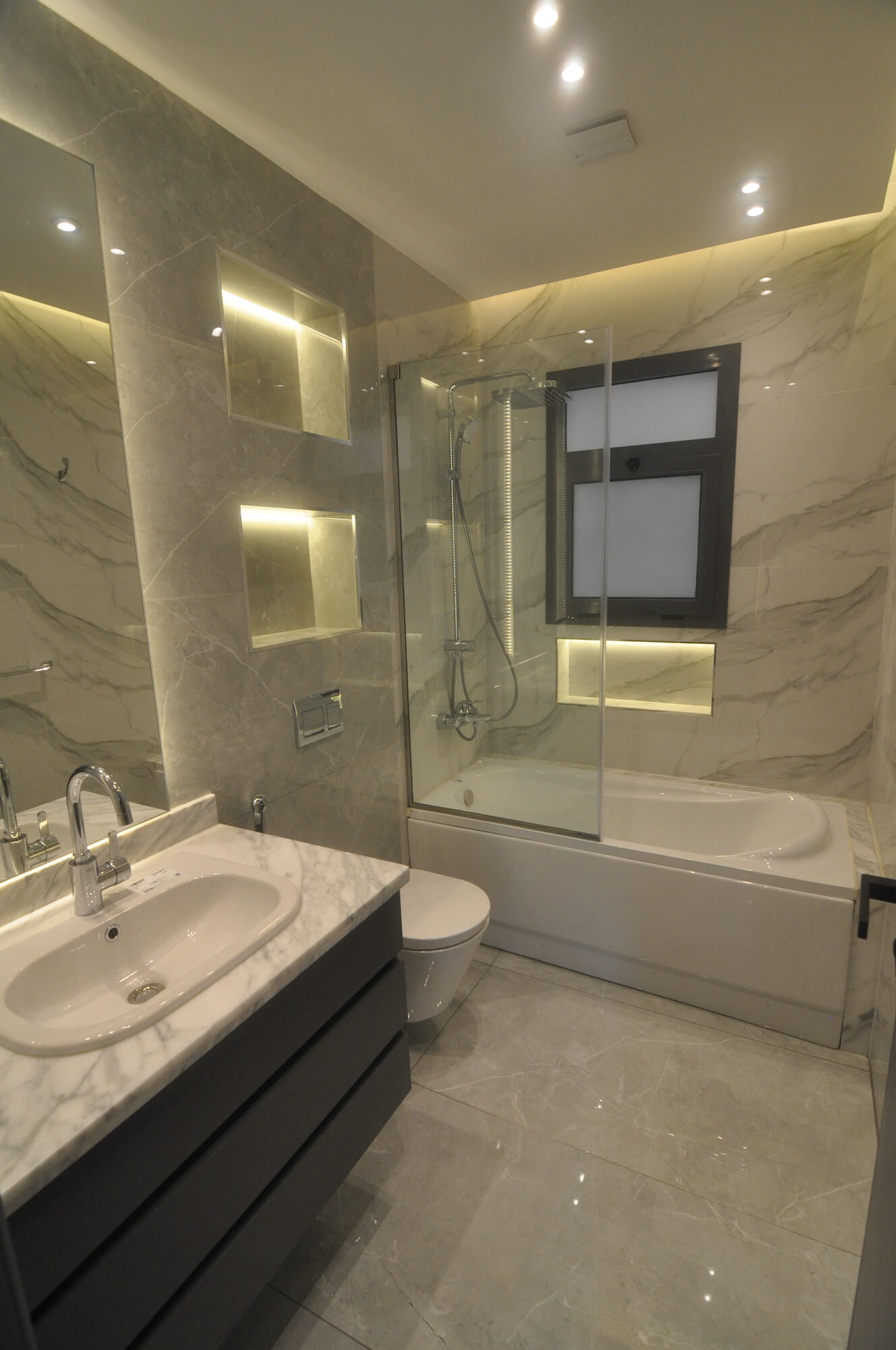 Contemporary bathroom with sleek finishes and floating vanity in 2024 residential project