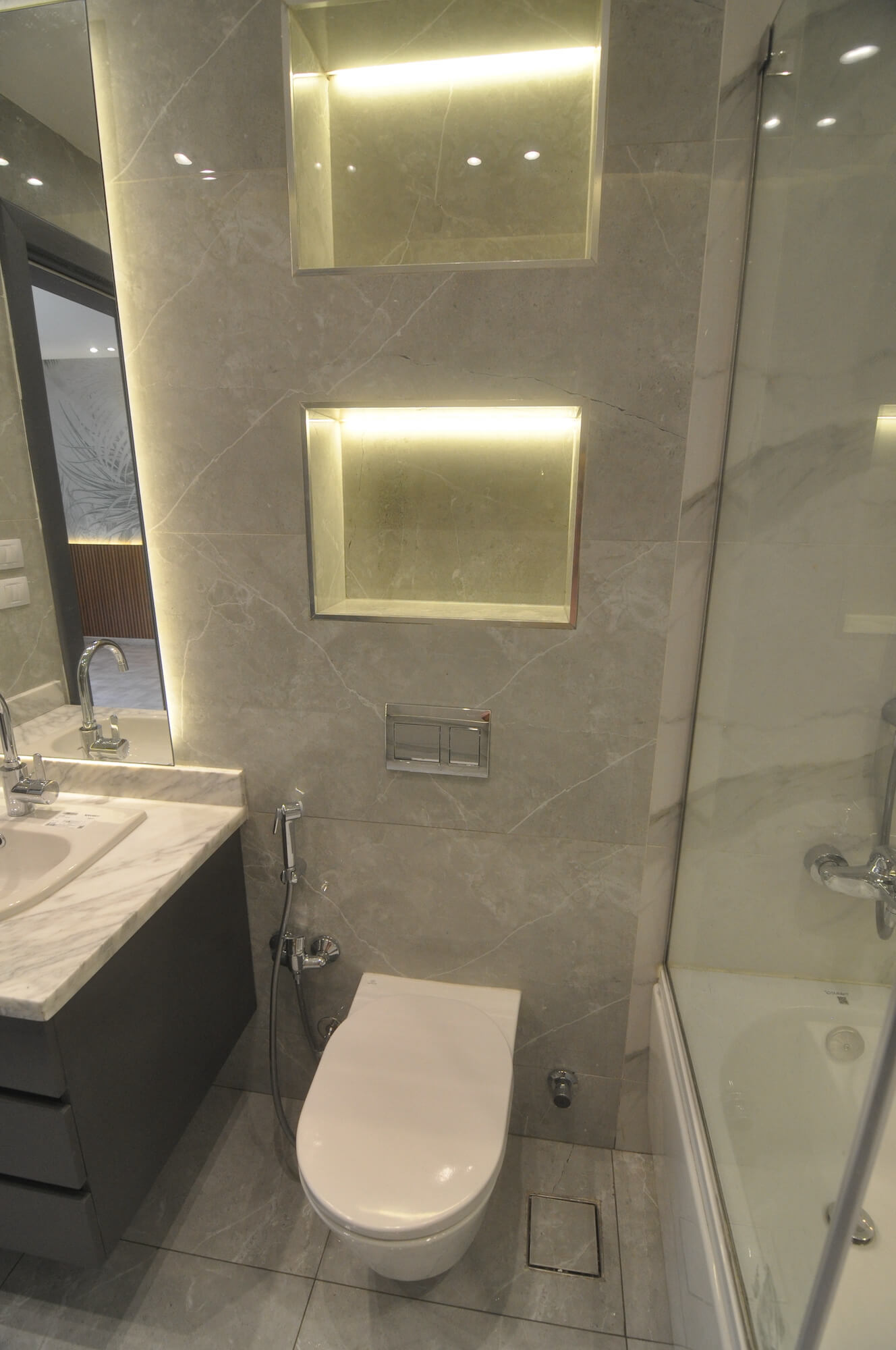 Contemporary bathroom with sleek finishes and floating vanity in 2024 residential project