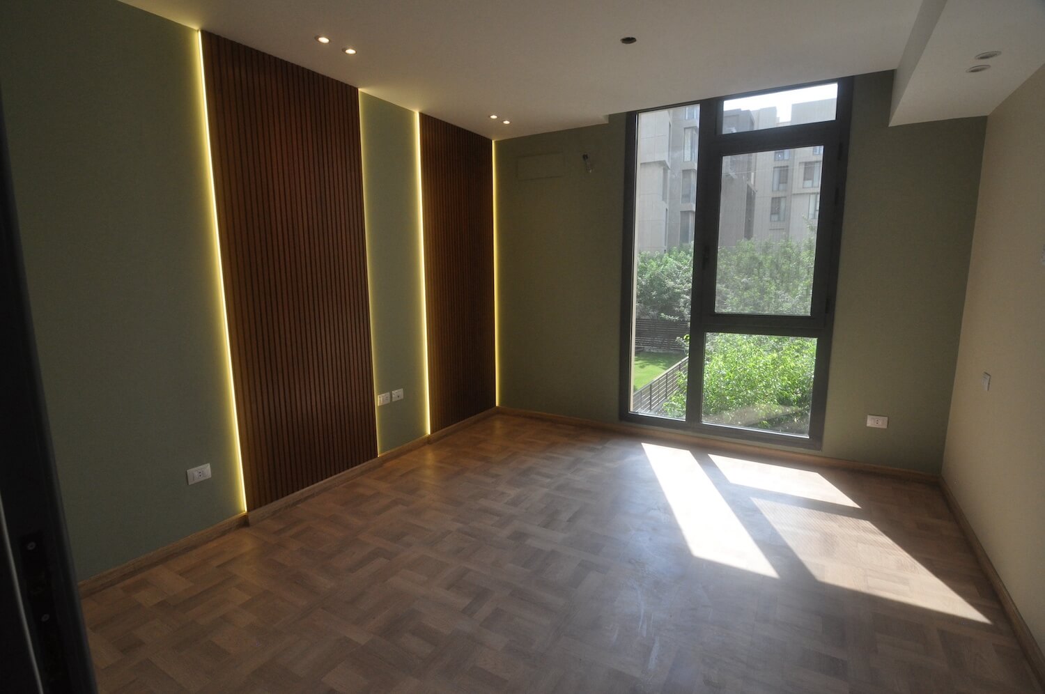 	Cozy guest bedroom with neutral palette and built-in storage in Eastown home